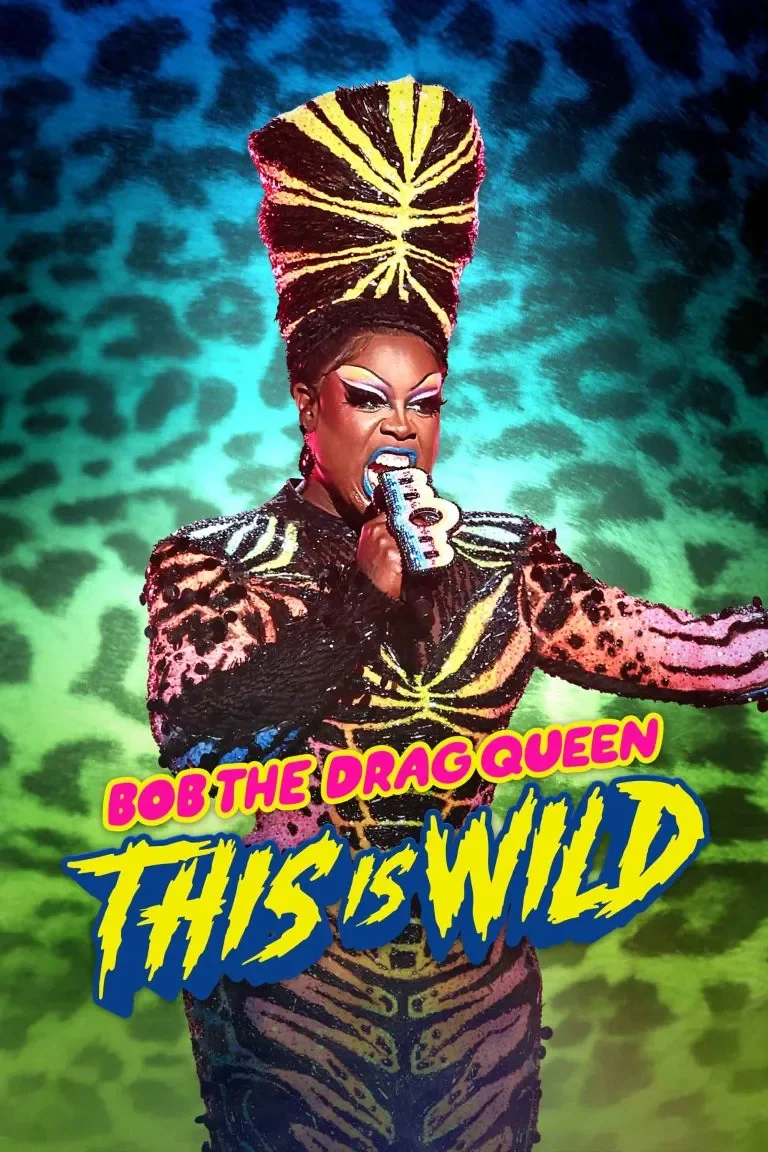 A drag queen with elaborate makeup and a tall, colorful, feathered headdress. She is wearing a sequined outfit with animal print and is holding a silver microphone. The background is vibrant with green and blue hues. Text overlay reads "Bob the Drag Queen" in pink and yellow and "This is Wild" in large yellow and blue stylized font.