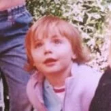Young girl looking up in awe at the sky
