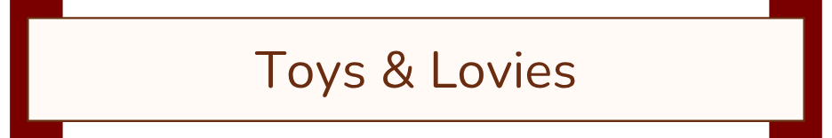 Sign that reads "Toys & Lovies" with a brown border and white background