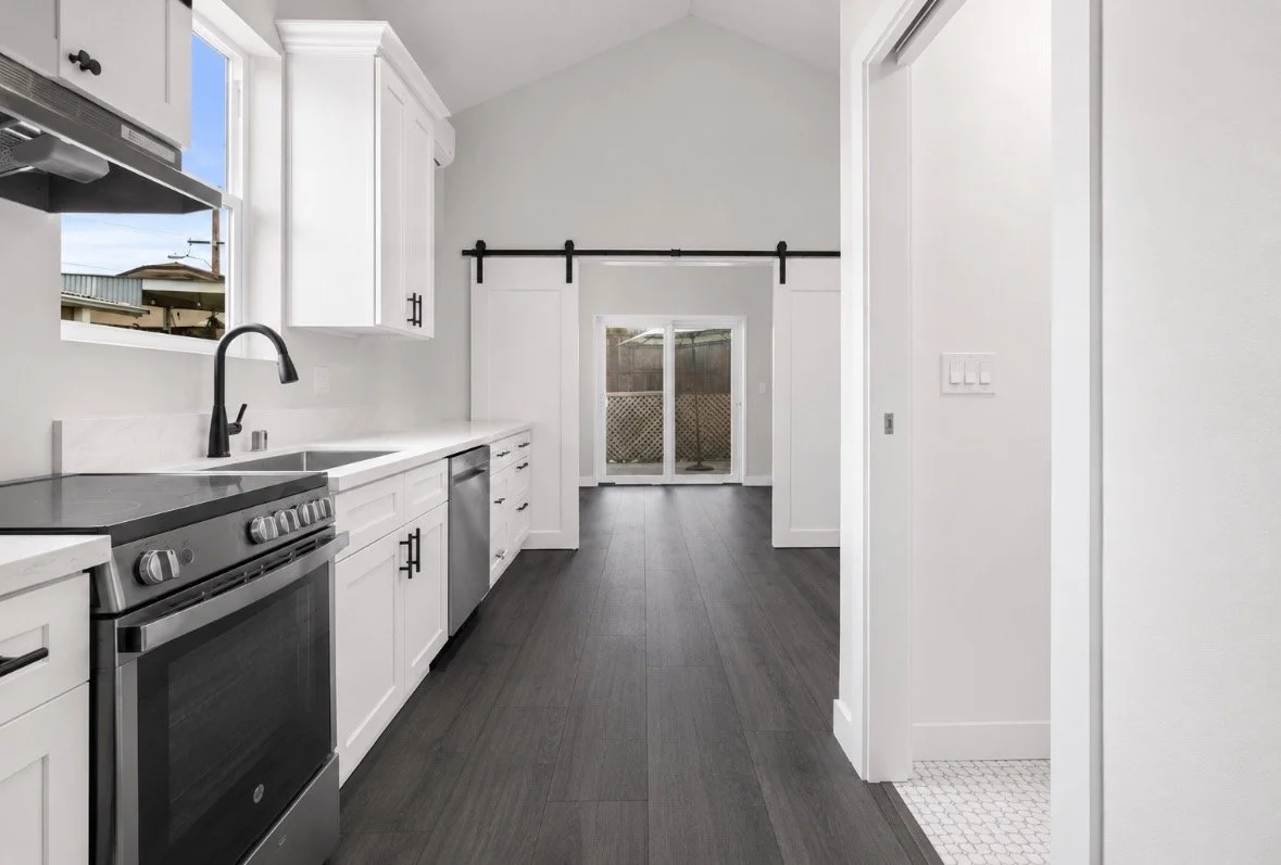 Barn-yard style doors separating the kitchen from the dining room