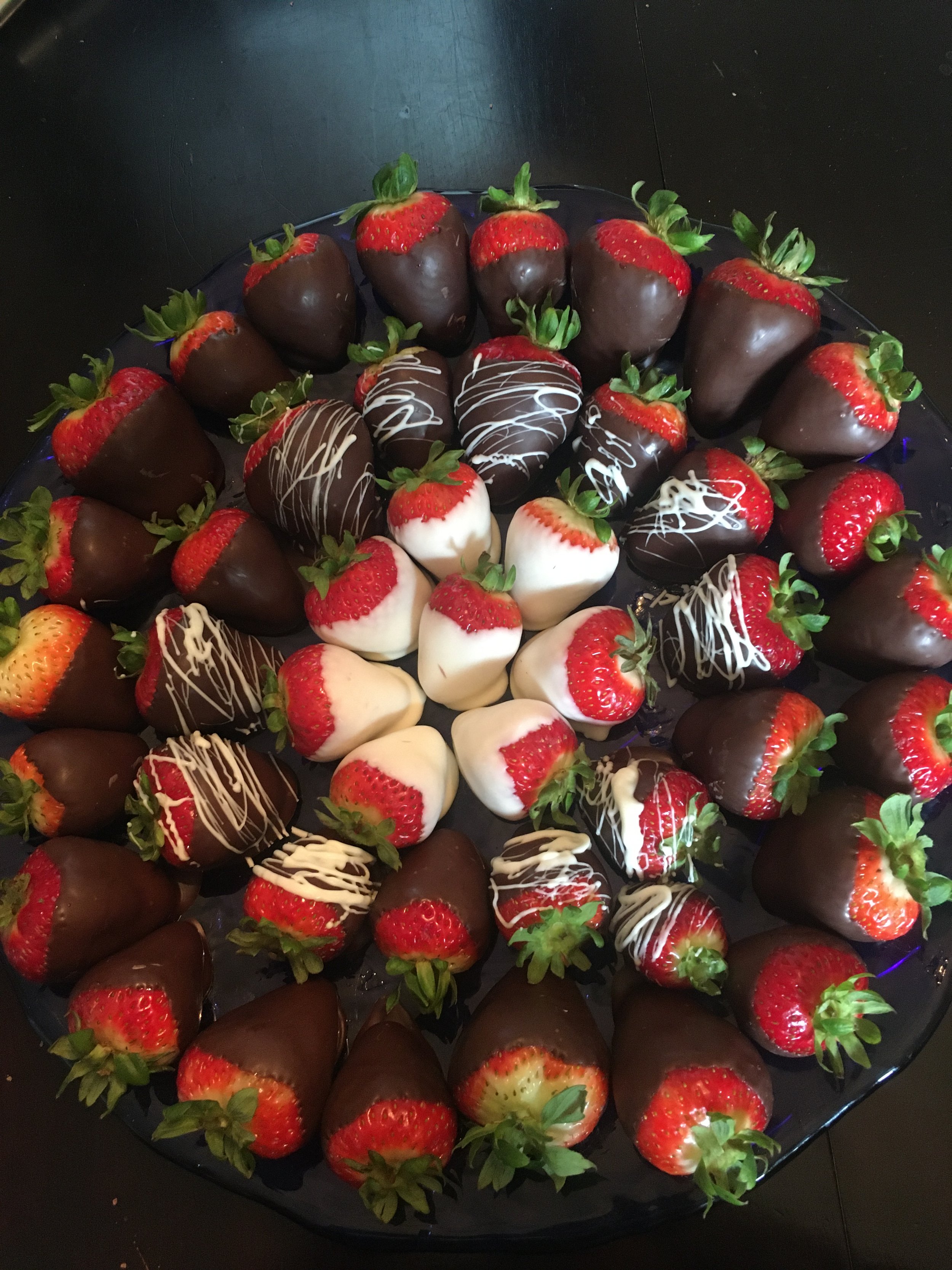 Chocolate-covered strawberries available in in orders of 6 and 12. A crowd pleaser (5 day advance notice)
