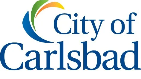 Logo of the City of Carlsbad featuring stylized waves and the text 'City of Carlsbad'.