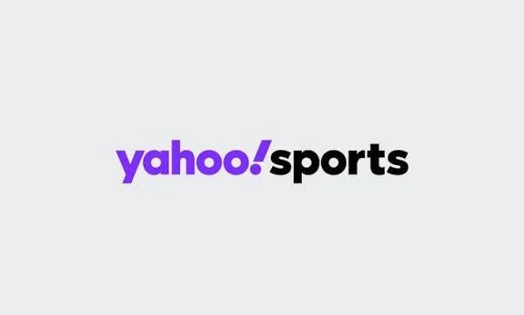 Yahoo Sports logo with purple and black text on a gray background.