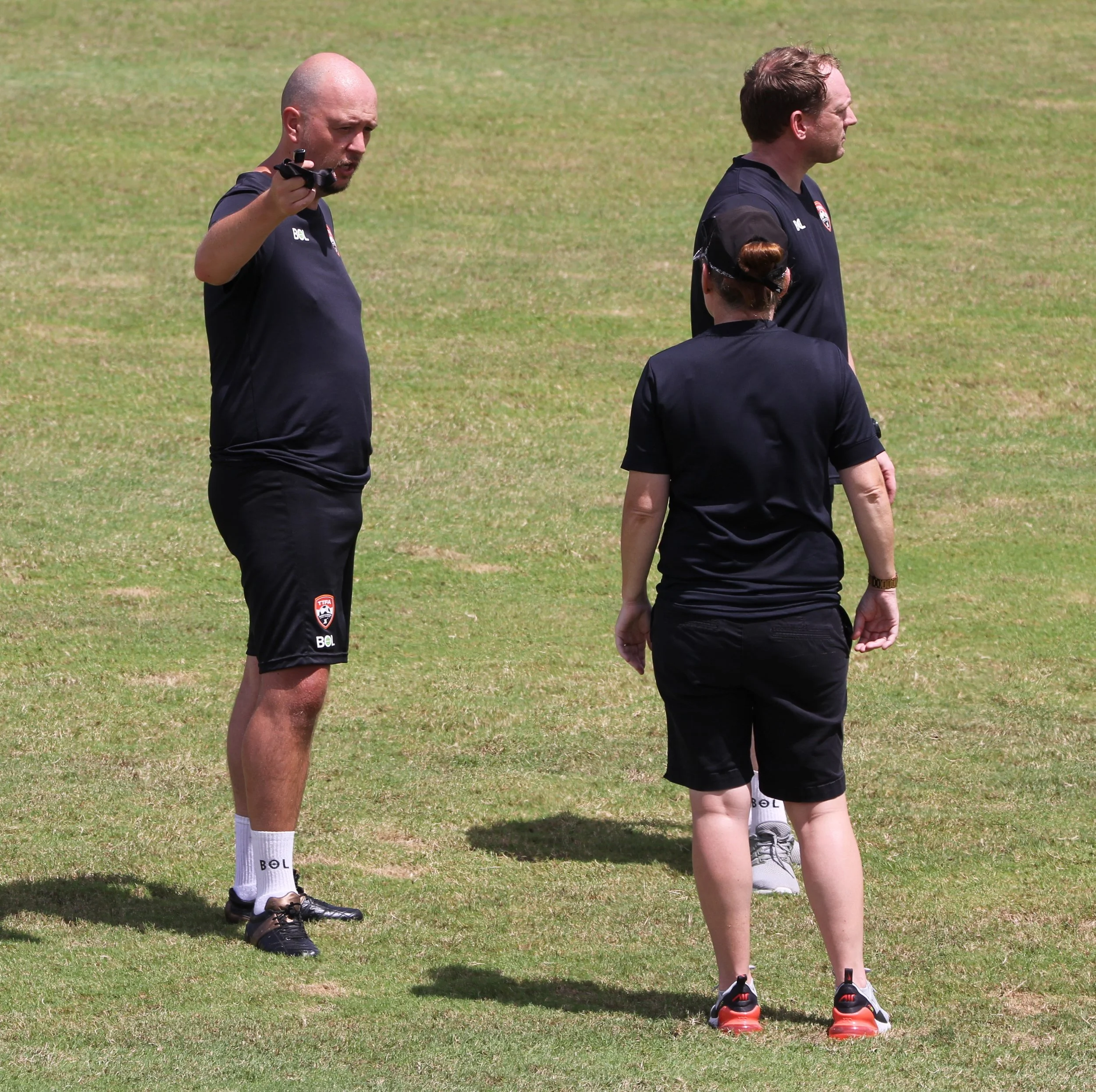 James Thomas Head Coach, TTFA Womens National Team talking with staff during National Team Camp
