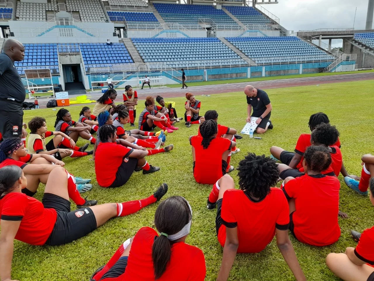 James Thomas Head Coach, TTFA Womens National Team giving tactical information to players in the Ato Boldon Stadium, Couva