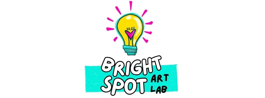 Colorful logo for Bright Spot Art Lab featuring a yellow light bulb with pink rays and a purple heart inside, with the text 'Bright Spot Art Lab' beneath.