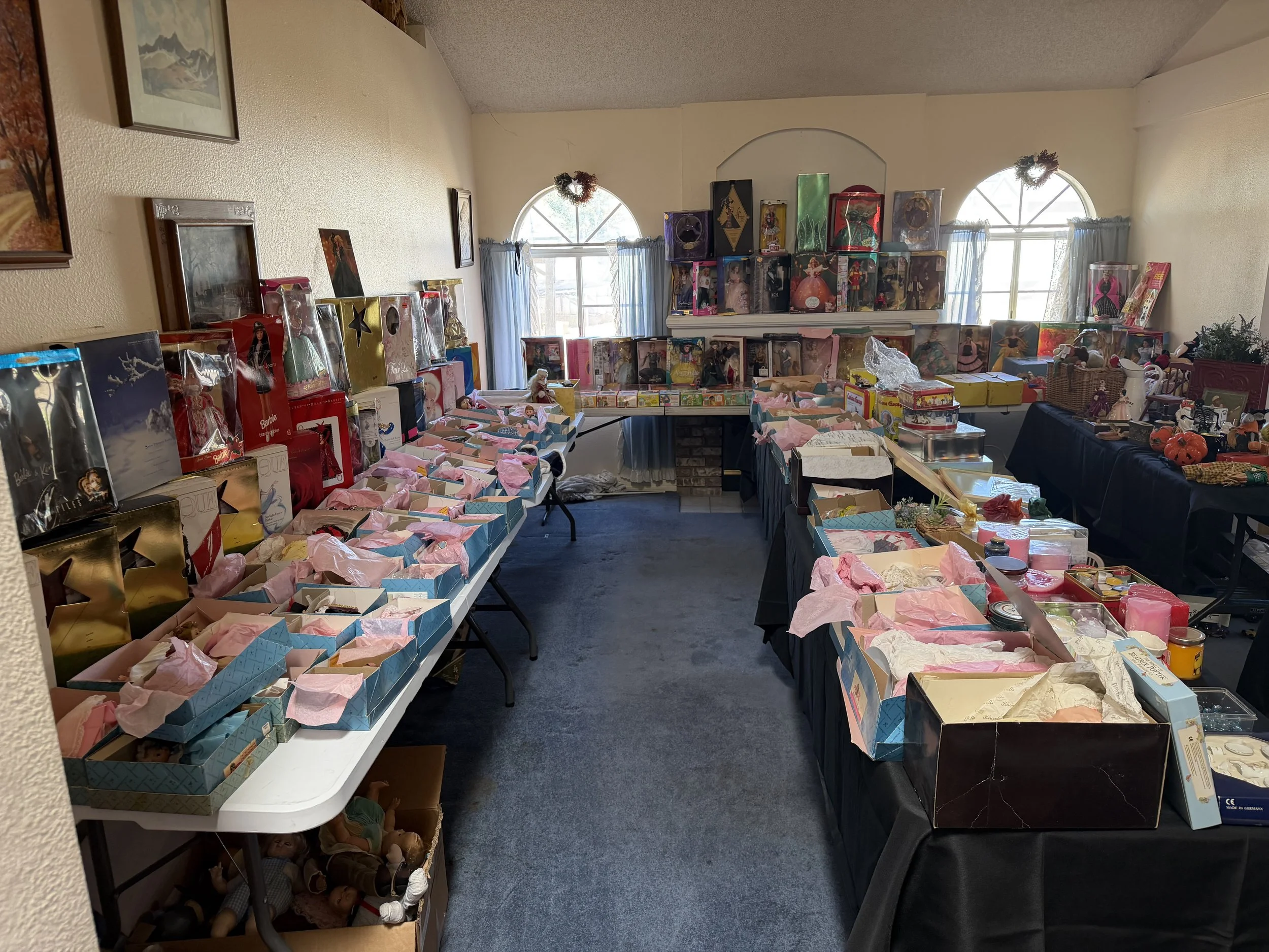 All Barbies were organized and moved to the living room to be placed on display. There were only 8 or so dolls left after the sale!