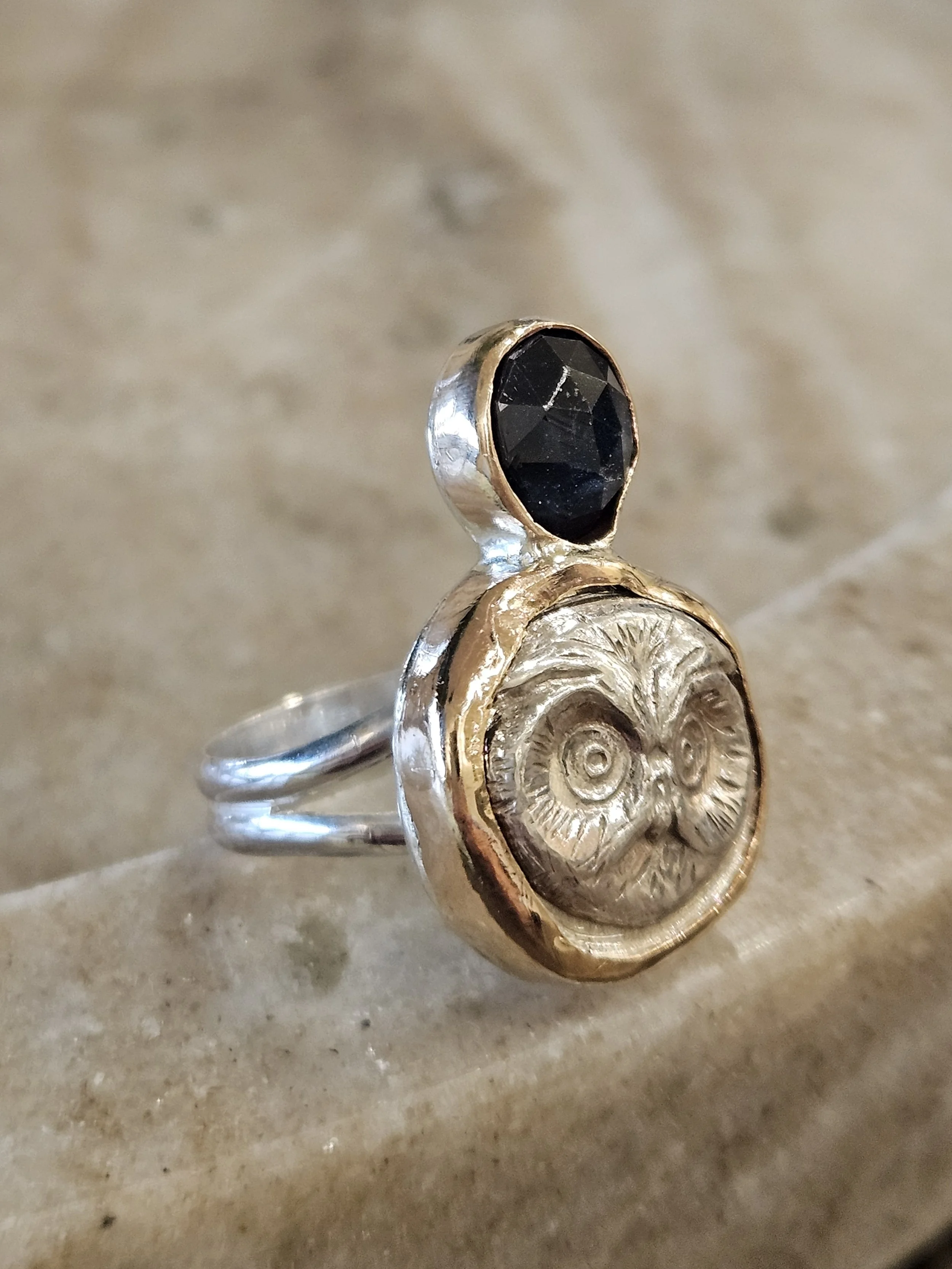 Blue sapphire, sterling silver split shank ring with Owl face and 14k GF bezels. Size 7.5 ring.