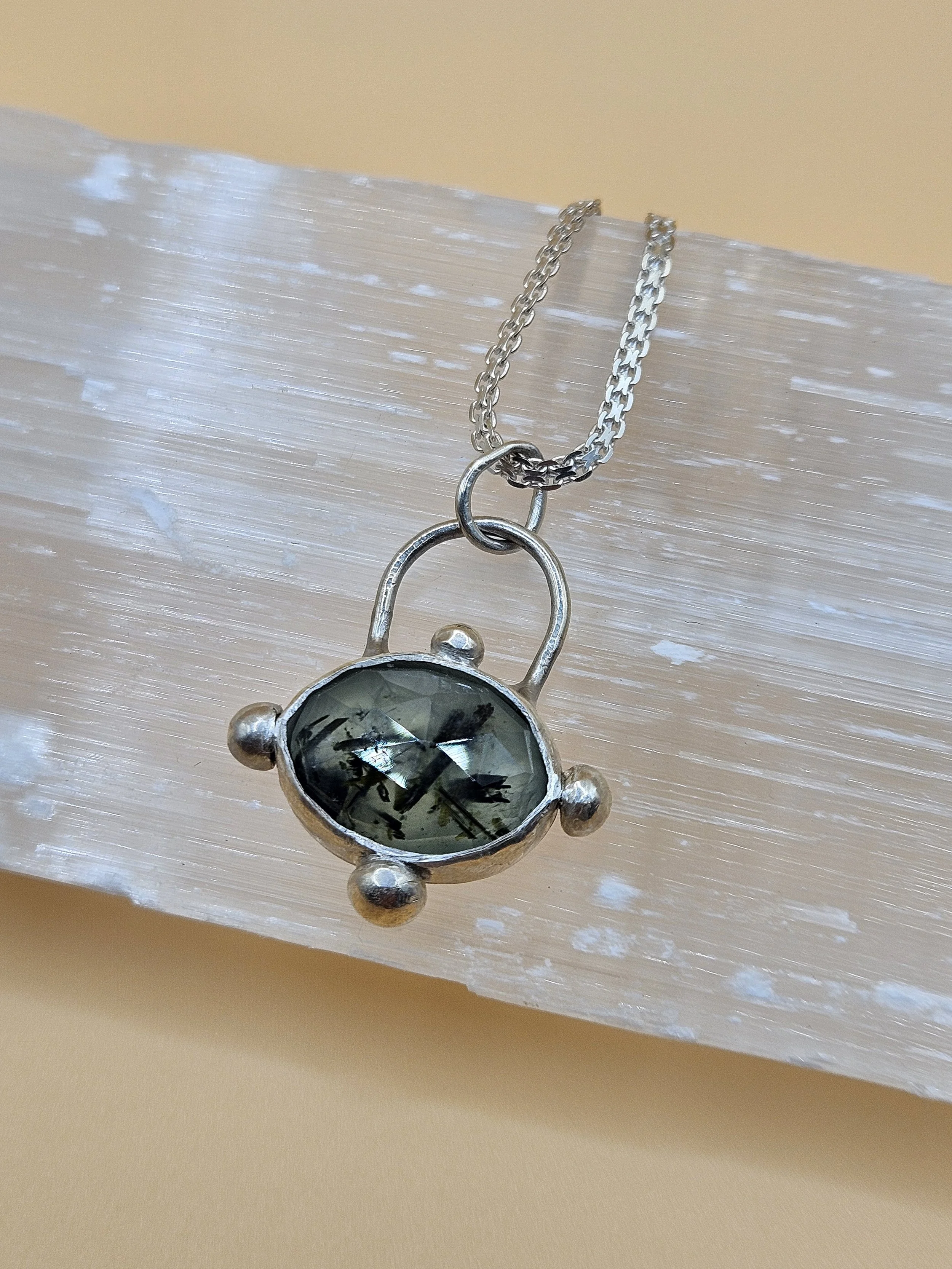 Sterling silver pendant with faceted Prehnite stone with silver balls. 