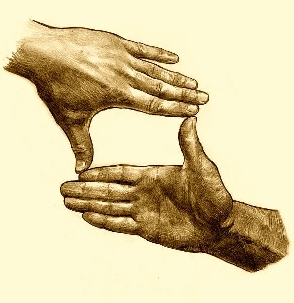 Two hands forming a "finger frame," one above and one below, with a light background. Many people loving making this position with their hands, and look through them, to simulate being a director.