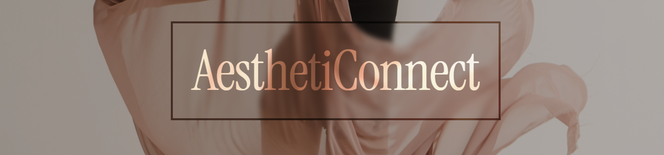 Close-up of a person's hand holding a transparent card with the text AestheticConnect in front of a blurred background.