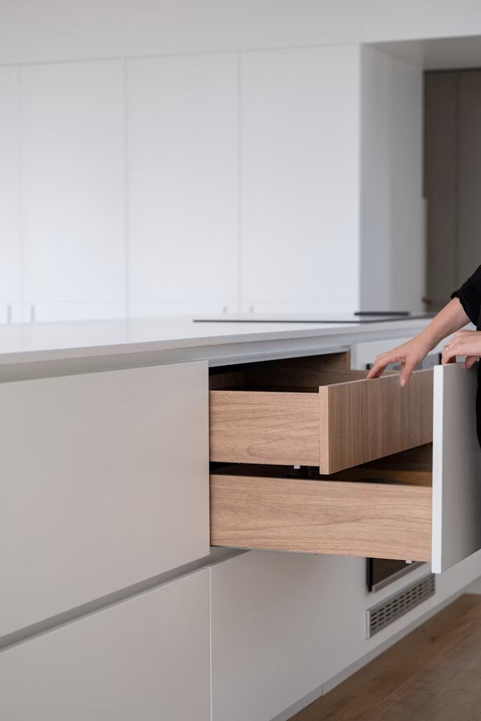 kitchen drawer with wooden interior in a modern kitchen.
