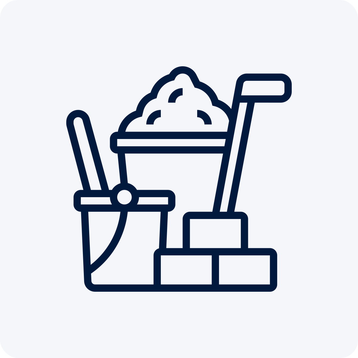 Line drawing of a wheelbarrow filled with dirt, a shovel, a saw, and bricks.