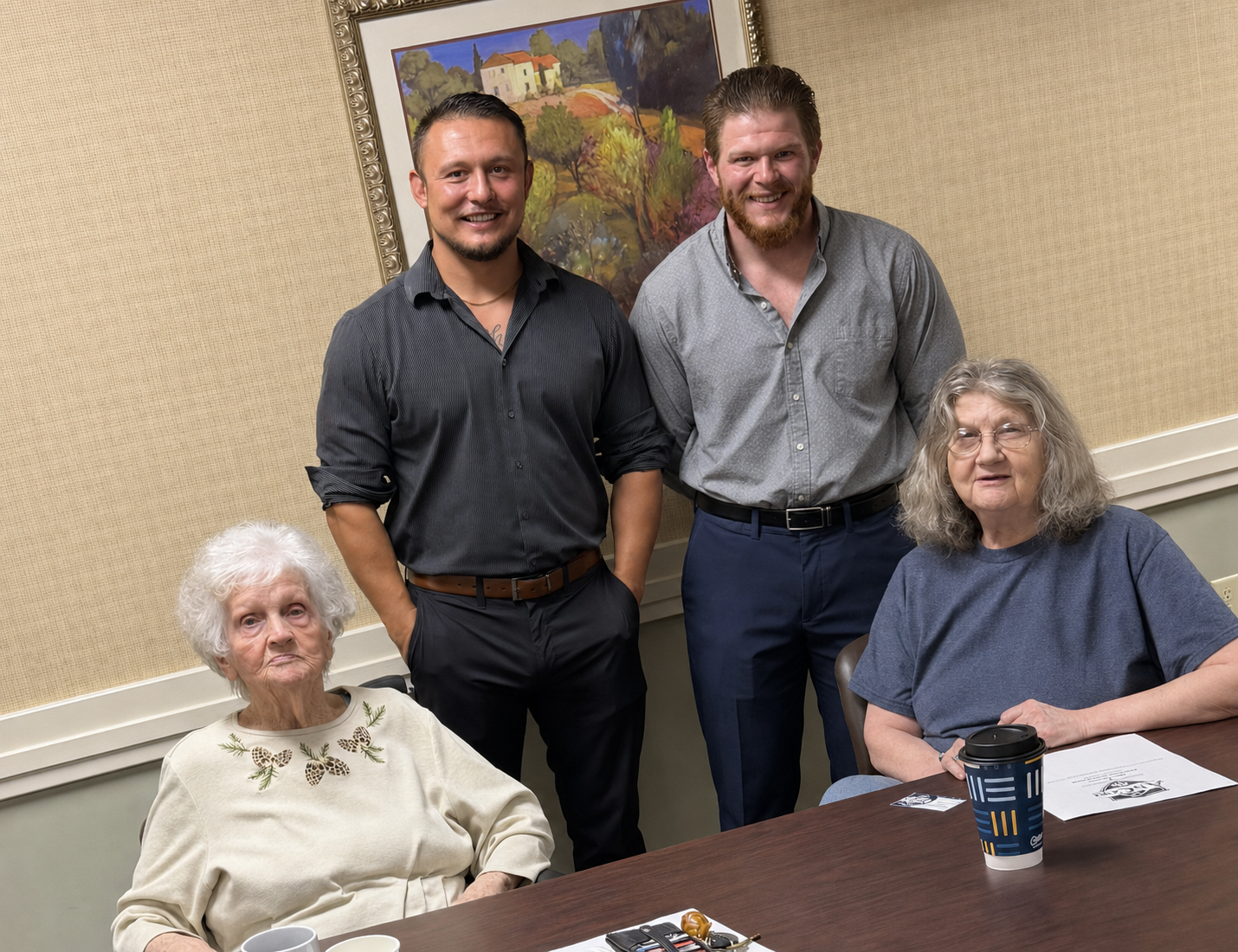 Travis Abner and Matt Conley with attendees after an AbCon Benefits senior presentation.