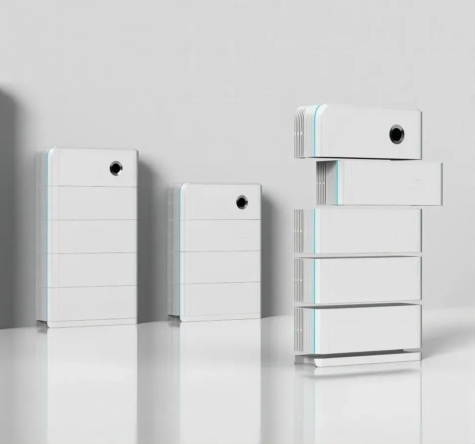 Three white architectural models with smooth rounded corners and a circular black opening, arranged on a white surface against a light gray background. The models increase in height from left to right, with the tallest model on the right having five levels.