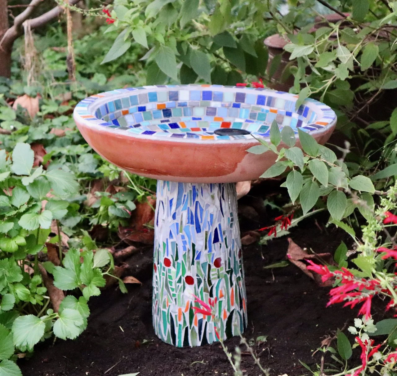 Bird bath made with glass tiles and sheet glass. 2023. 