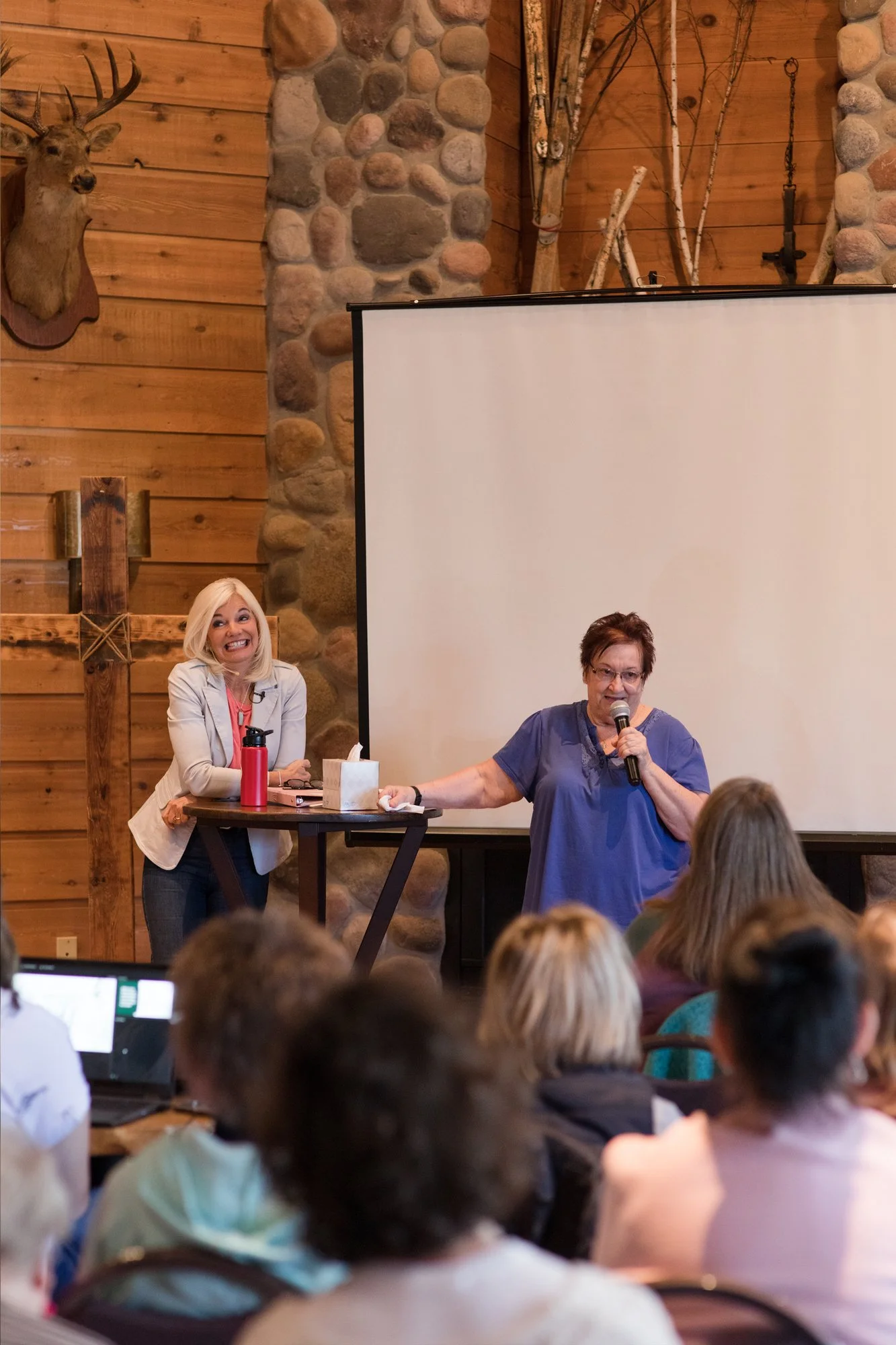 Bobbi Quiggle listening to a testimony from retreat