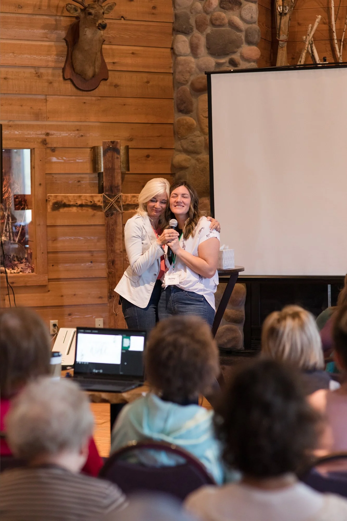 Bobbi Quiggle hugging a women at a retreat