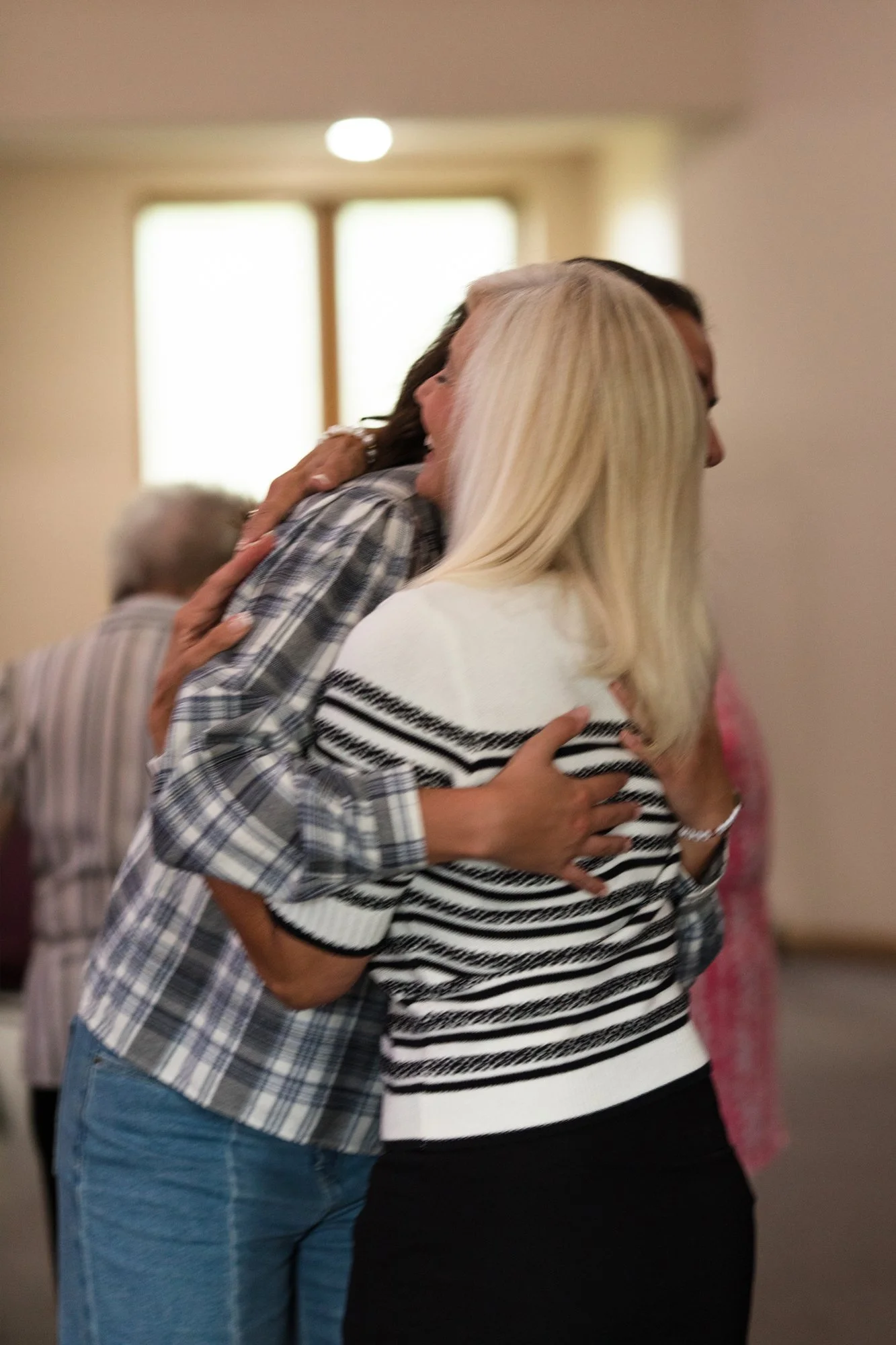 Bobbi Quiggle hugging an attender