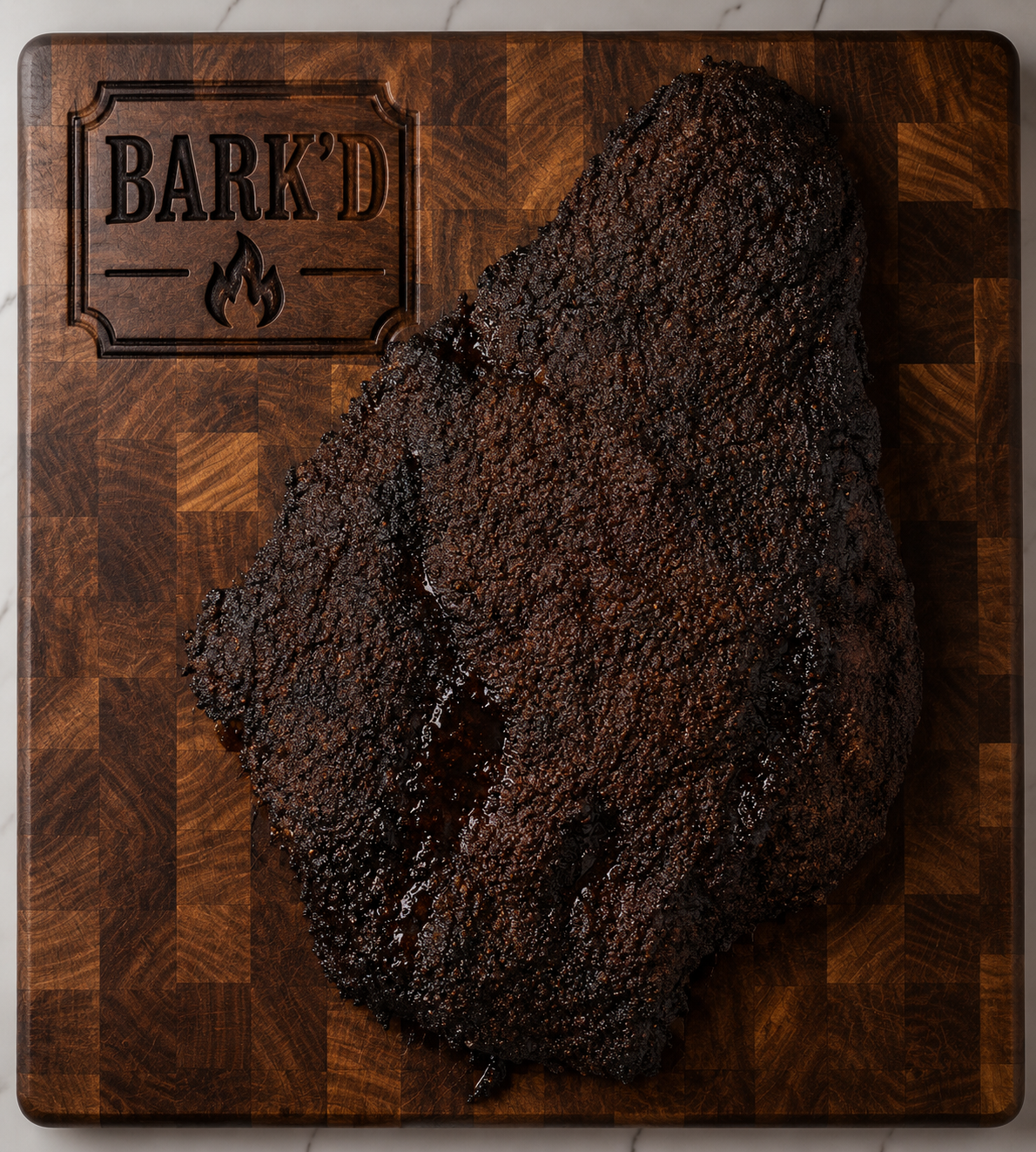 A large piece of burnt ends on a wooden cutting board engraved with 