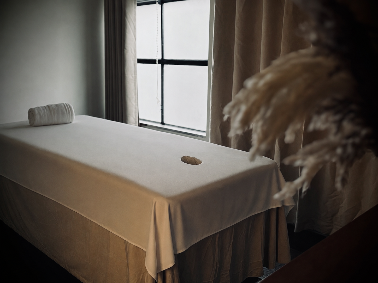 Private treatment room at FLUX Melbourne CBD featuring a premium massage table designed for relaxation and men's wellness.