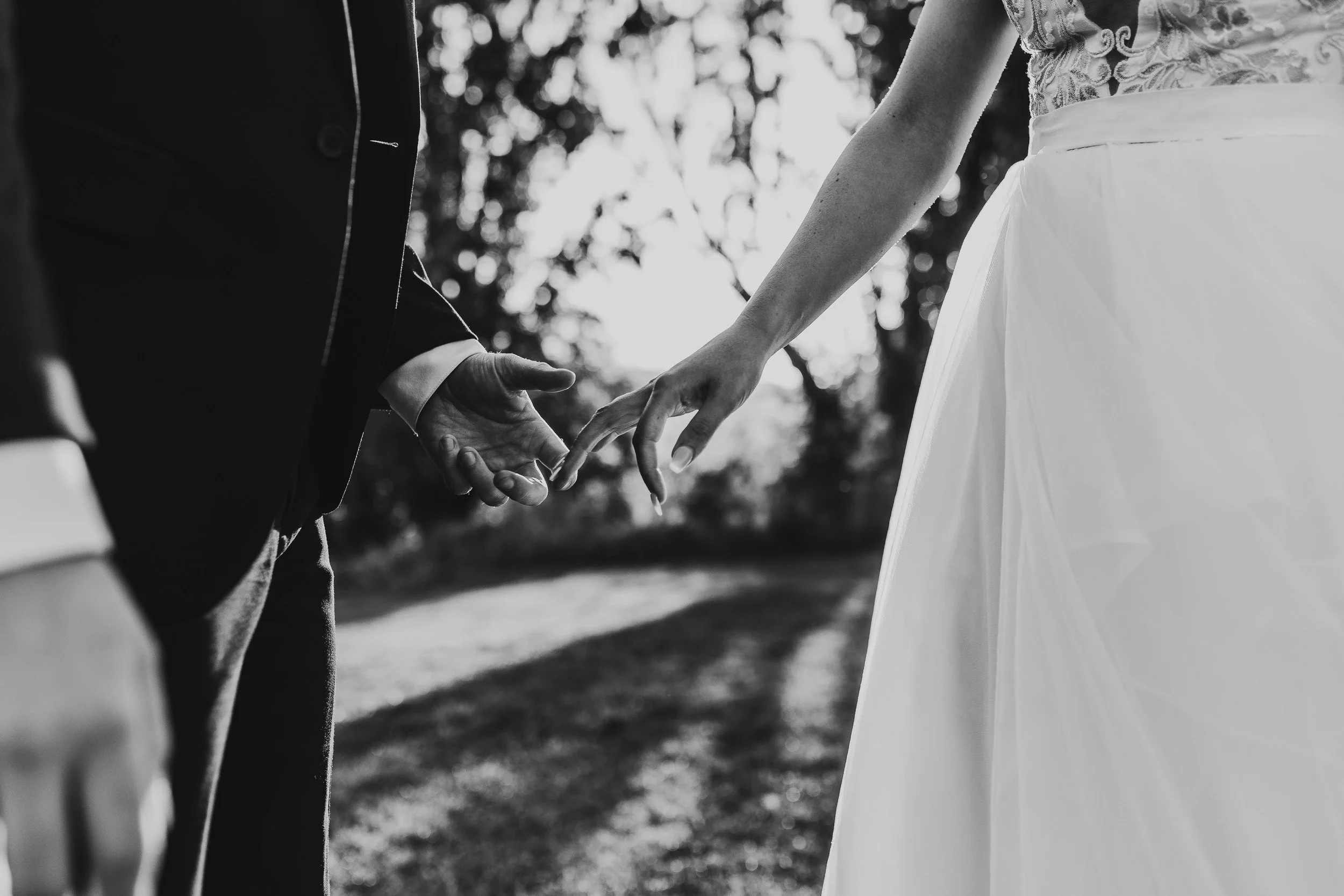 Braide and Groom holding hands black and white images