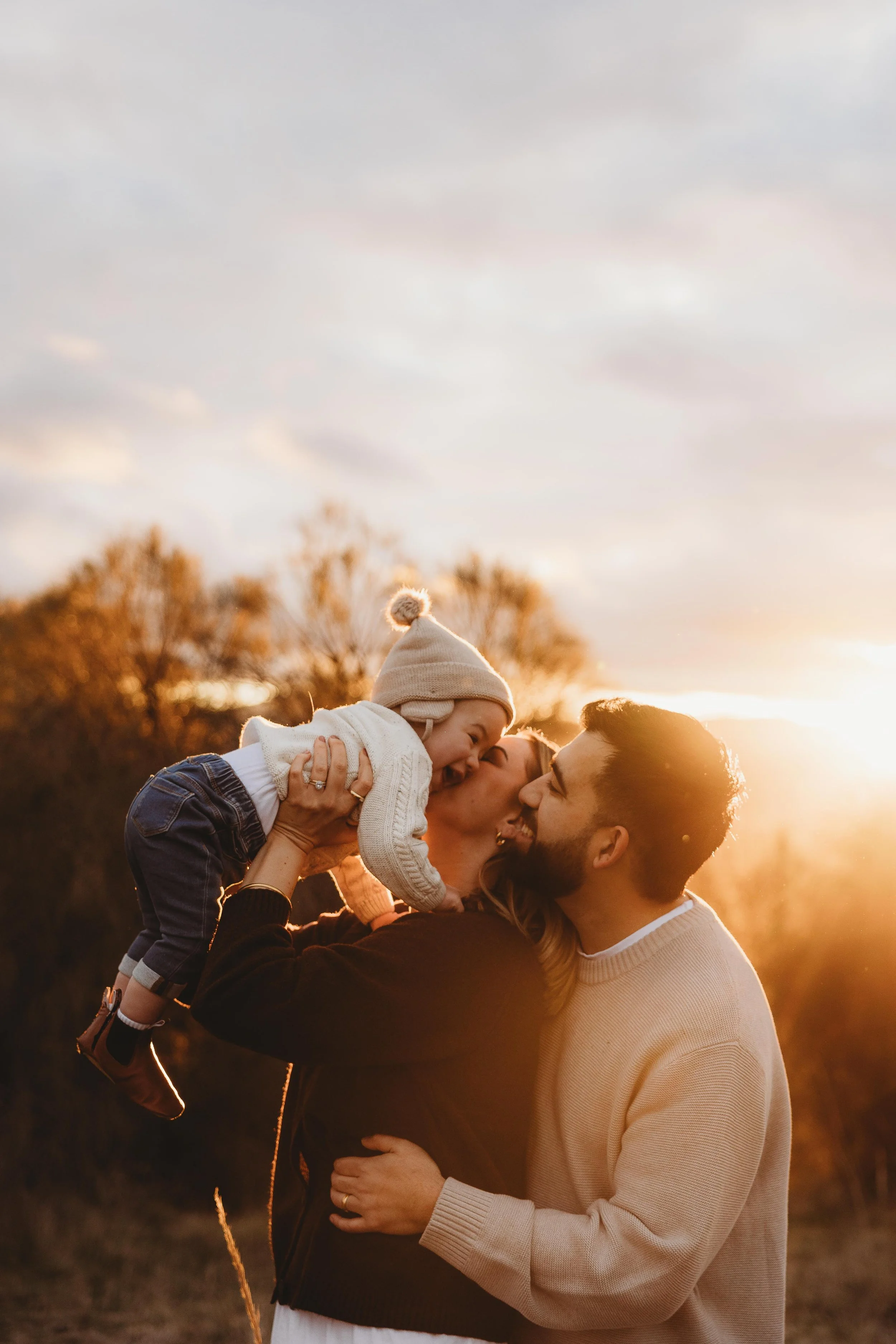 family together soaking up the winter sun glow
