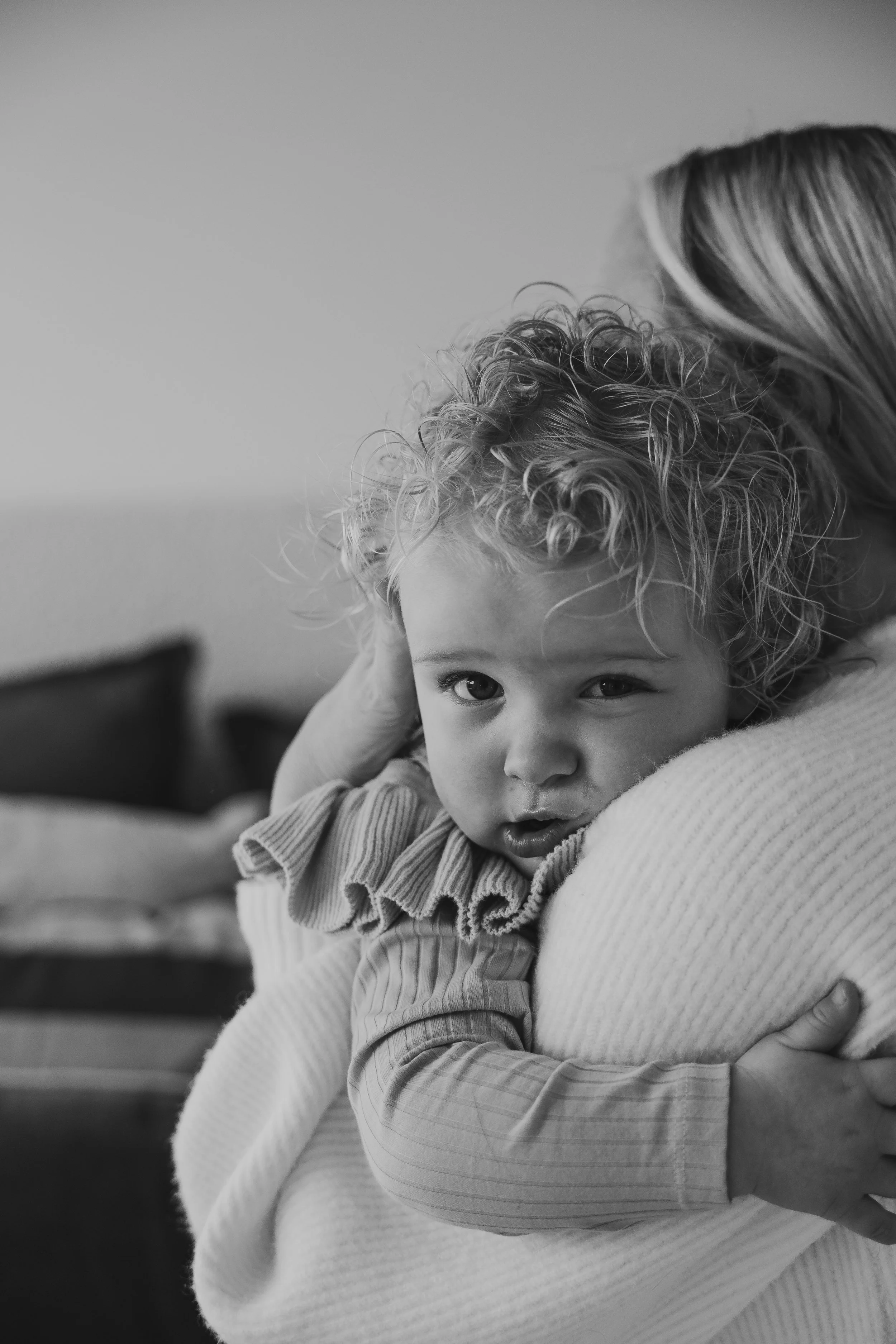 mother and daughter embracing in a cuddle