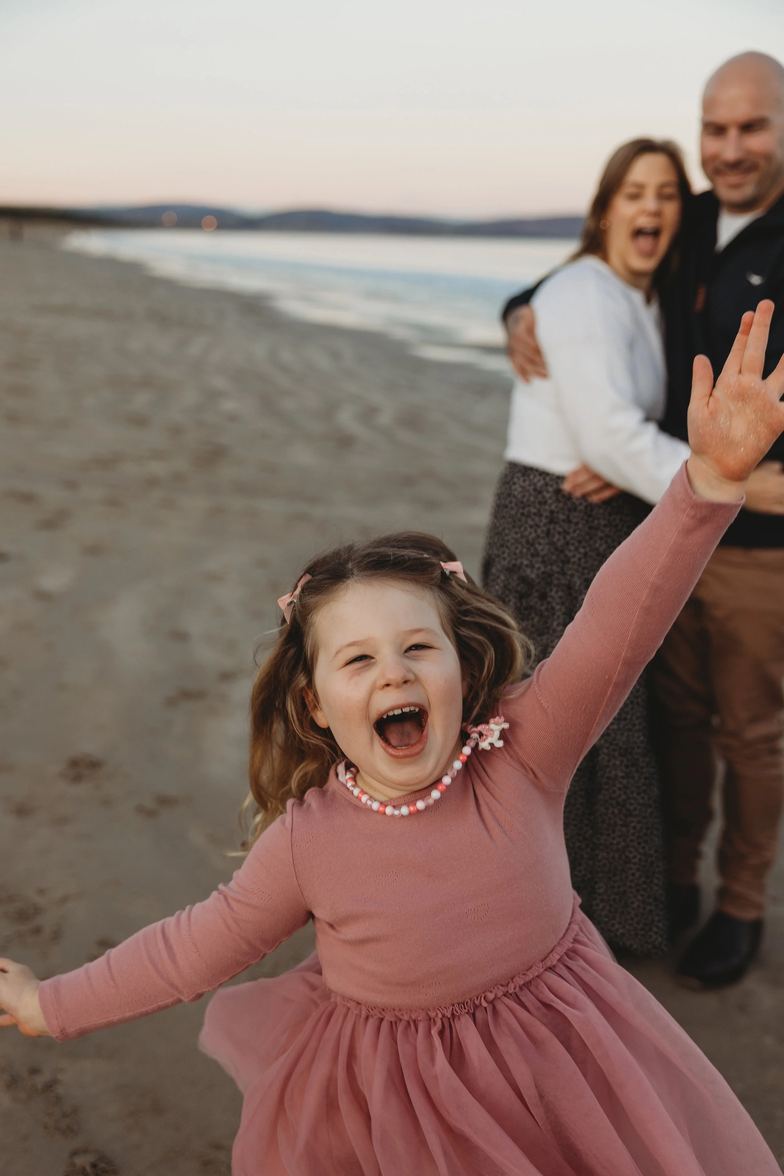family on beach having fun