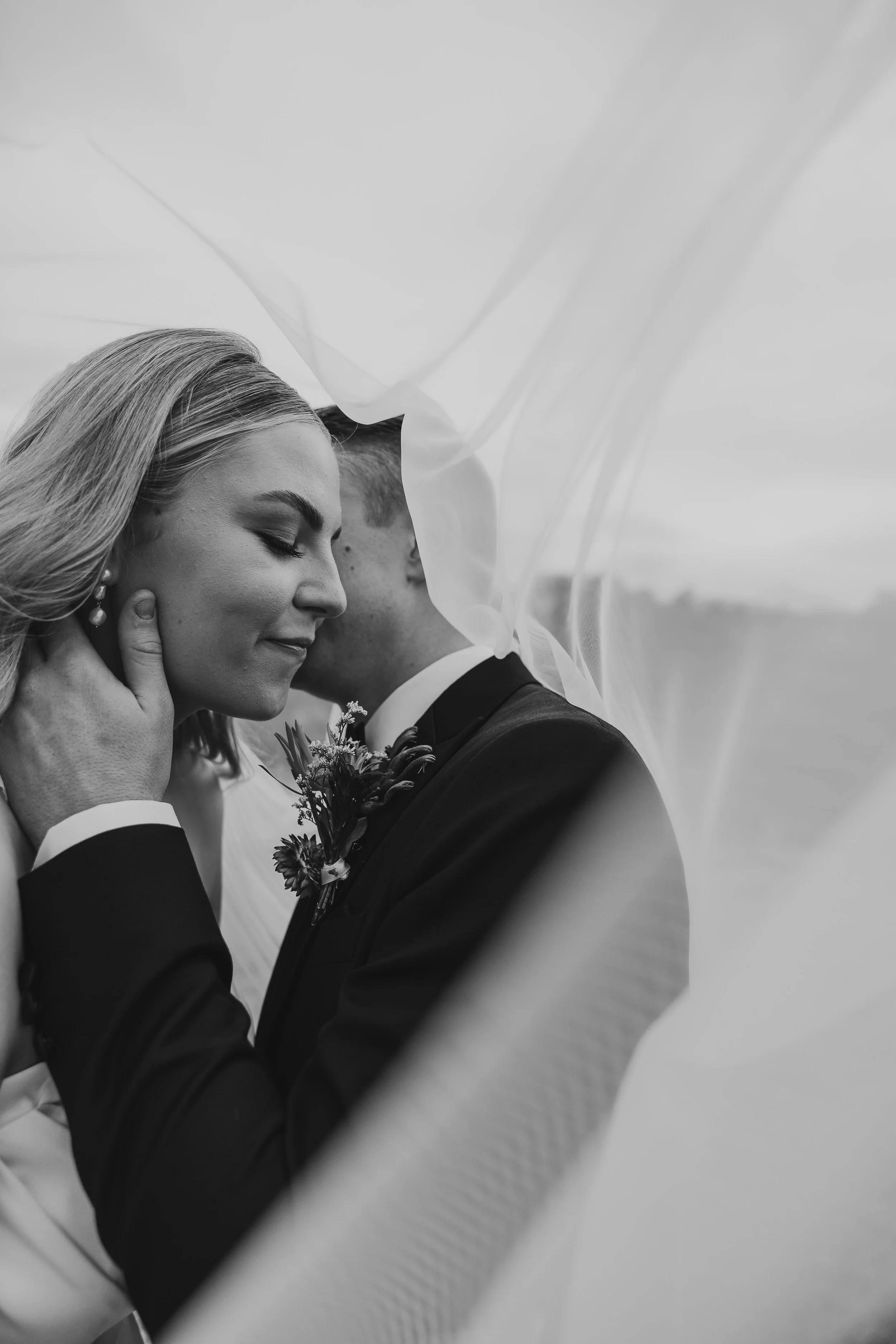 Husband and wife embracing on wedding day 