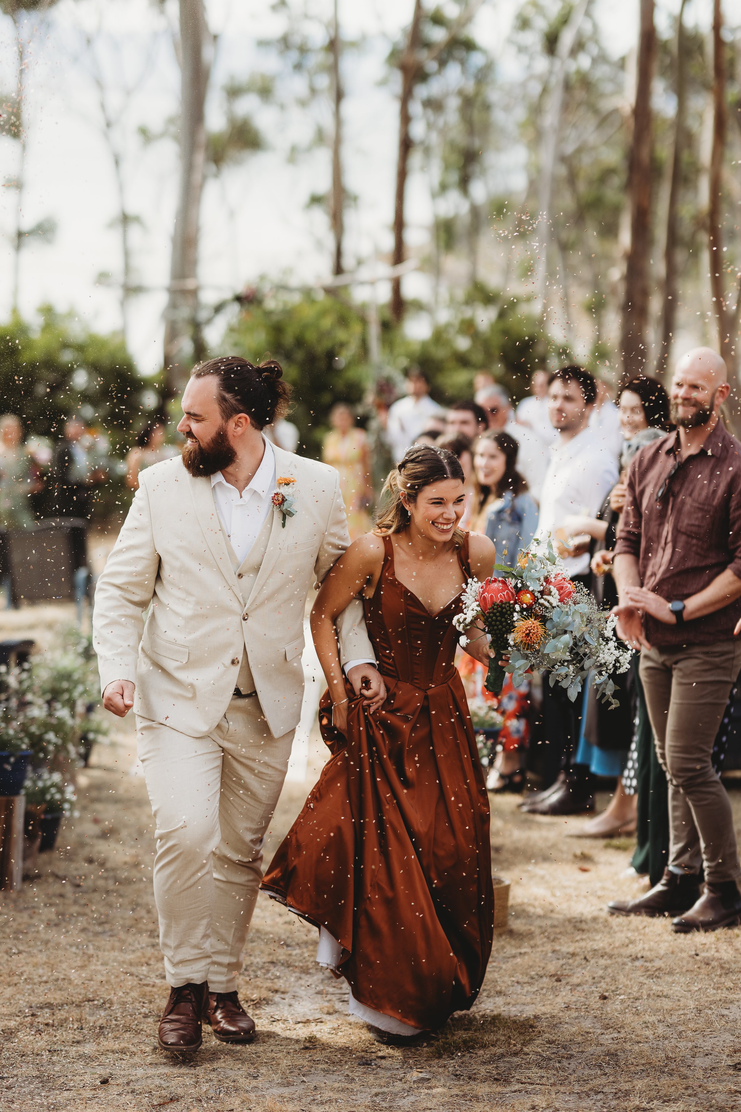 bride and groom leaving ceremony at wedding