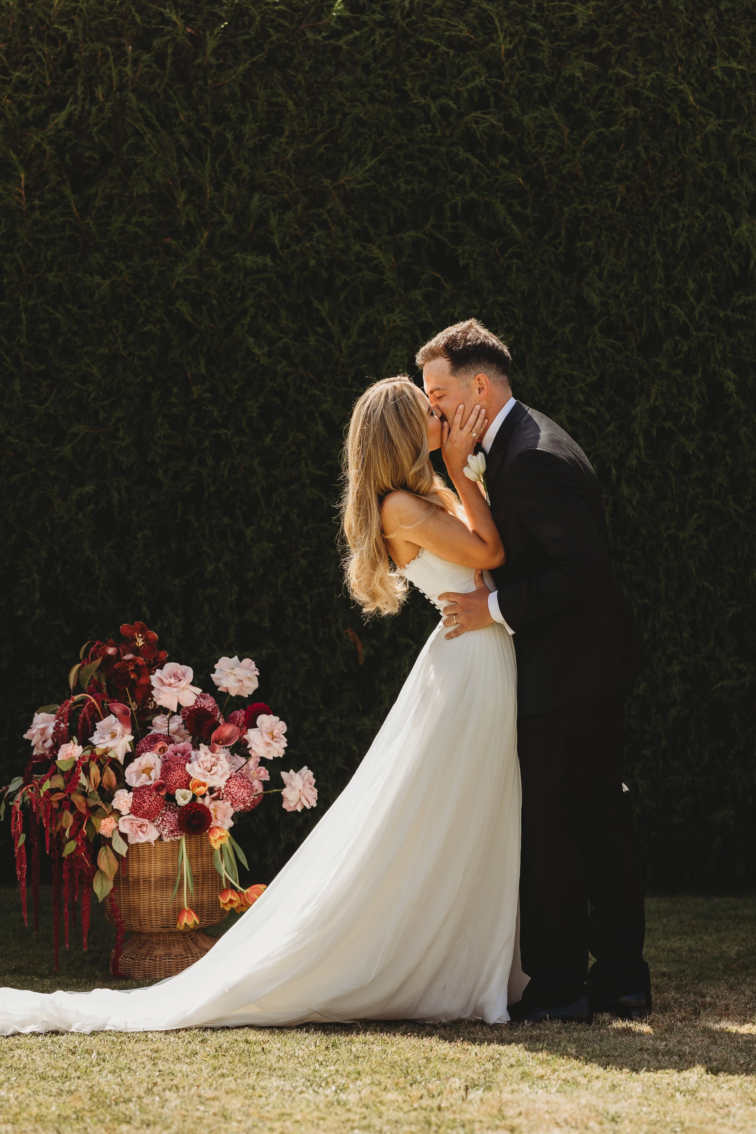bride and groom kissing at wedding ceremony