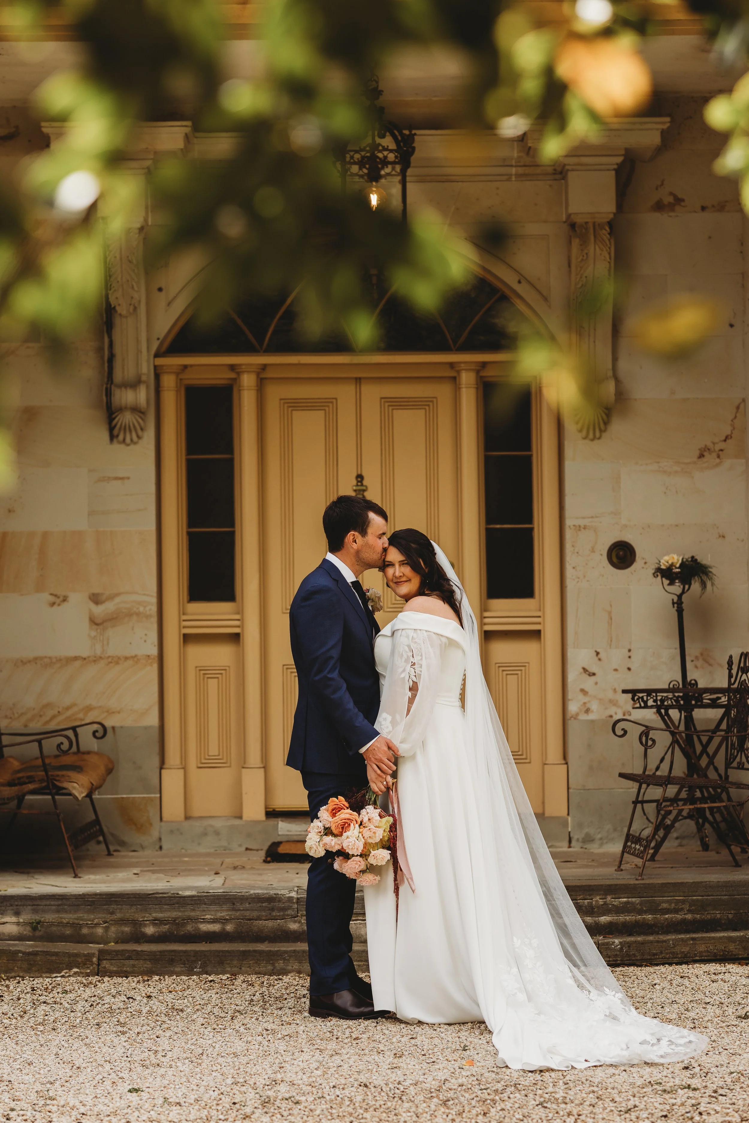 bride and groom out the front of heritage building
