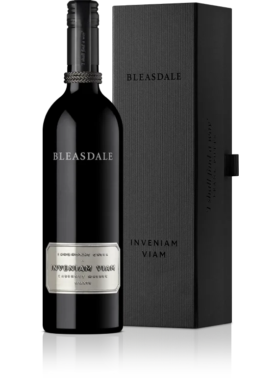 Wine bottle and gift box standing side by side