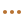 A bookshelf filled with various books and decorative items in a cozy room.