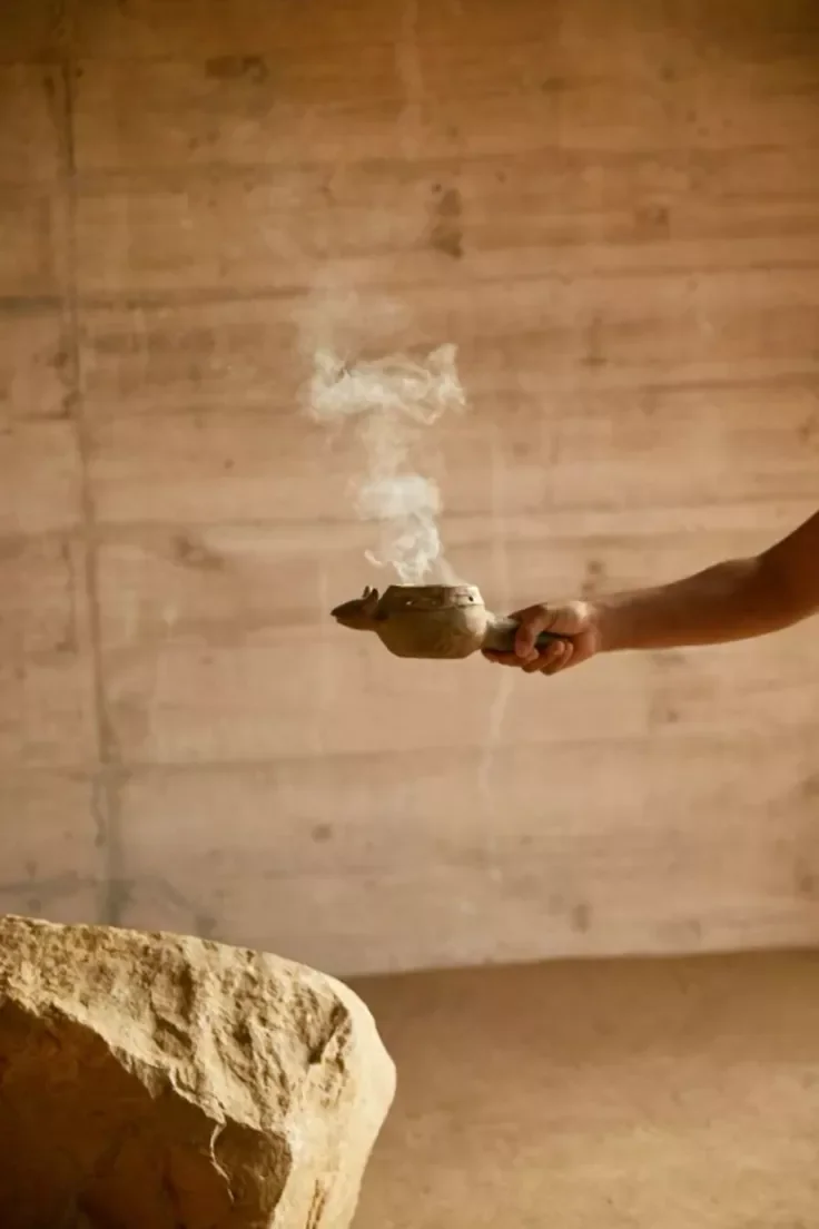 Cacao ceremony bowl with rising smoke — follow Maartje Wammes on Facebook