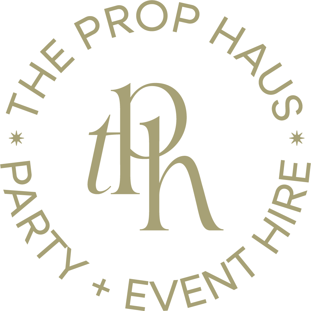 Logo for The Prop Haus, offering party and event hire services, featuring a circular design with the name and a stylized 'ph' in the center.