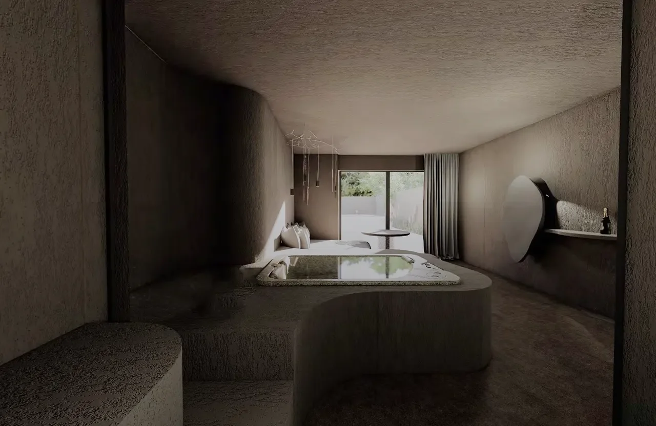 Chambre minimaliste avec un lit, un petit table ronde près de la fenêtre, une étagère avec une bouteille, et une grande pièce ronde fixée au mur.