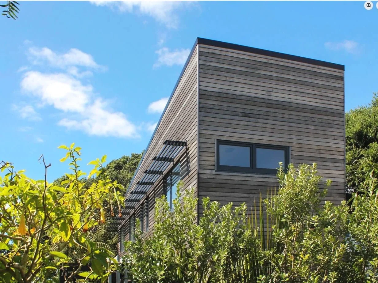 Adams Building architectural home with timber cladding, angular roofline in Fitzroy, New Plymouth.