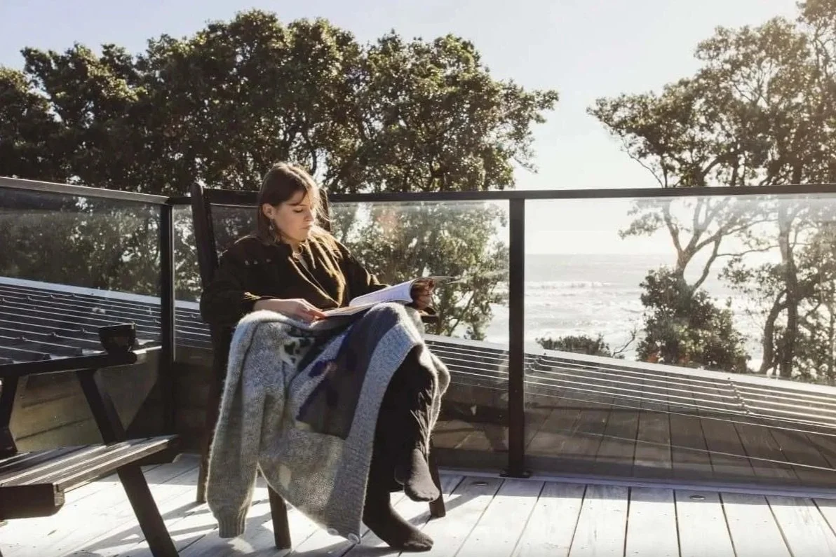 Adams Building outdoor deck with glass balustrade and coastal views in New Plymouth, Taranaki.
