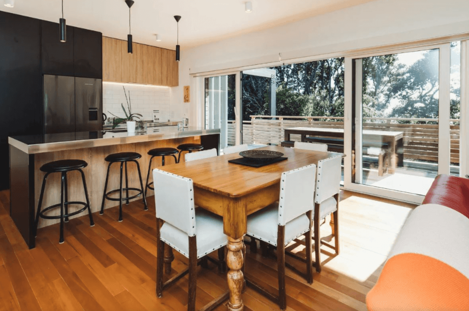 Adams Building architectural home with modern kitchen, open-plan dining and outdoor living in Fitzroy, New Plymouth.