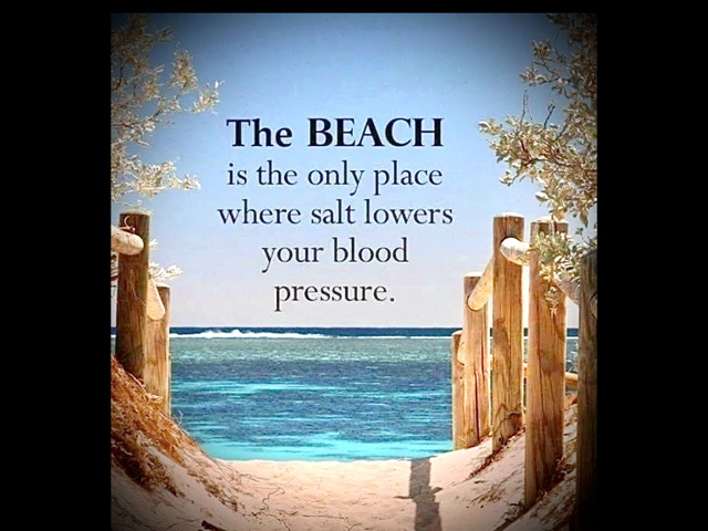 Beach scene viewed through a sand dune opening with wooden posts and a blue ocean in the background, overlaid with a quote about the calming effect of the beach.