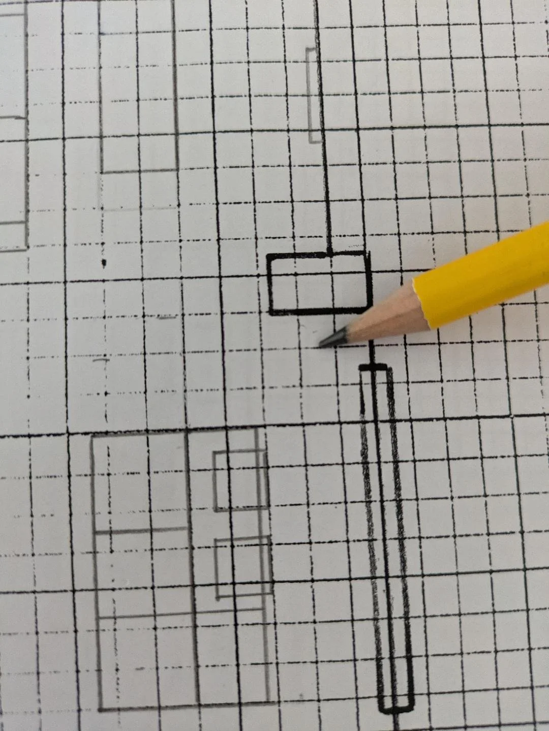 hand drawn graphic of a rudimental floor plan sketch and pencil