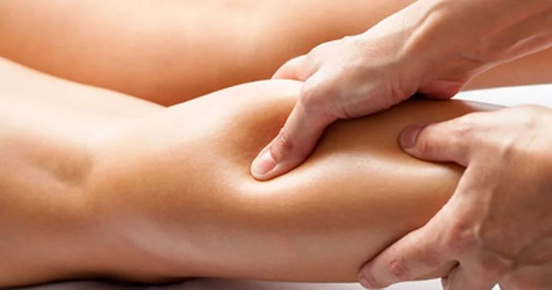 A person receiving sports massage in Wagga.