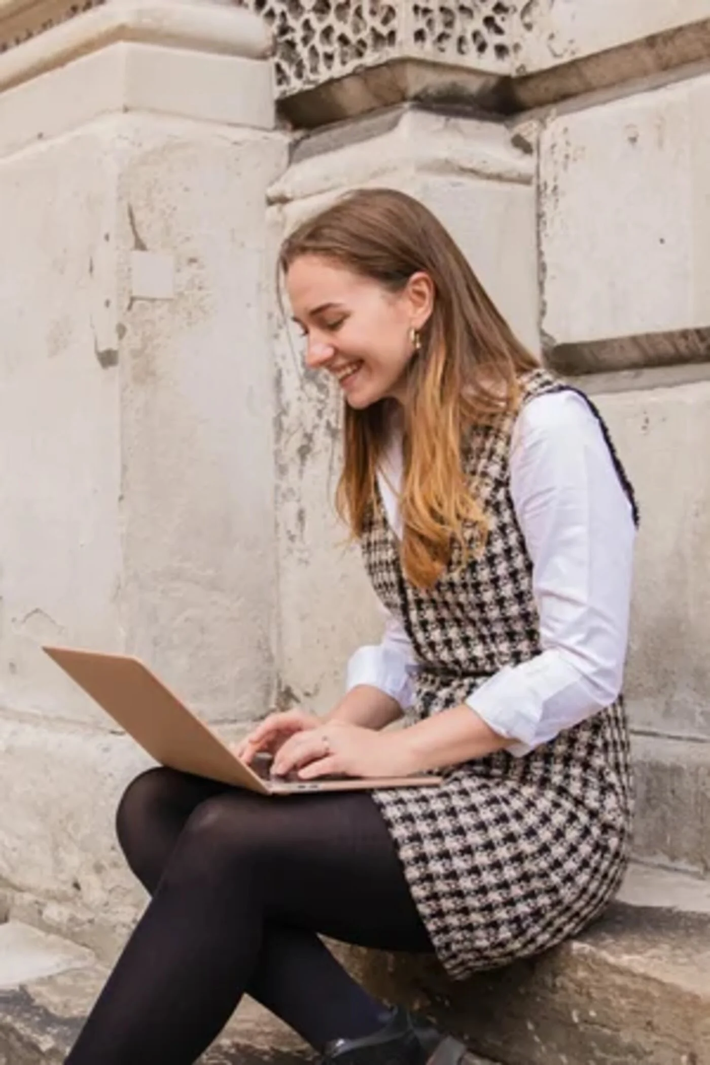 Hana Clode, interiors marketing consultant, working on a laptop