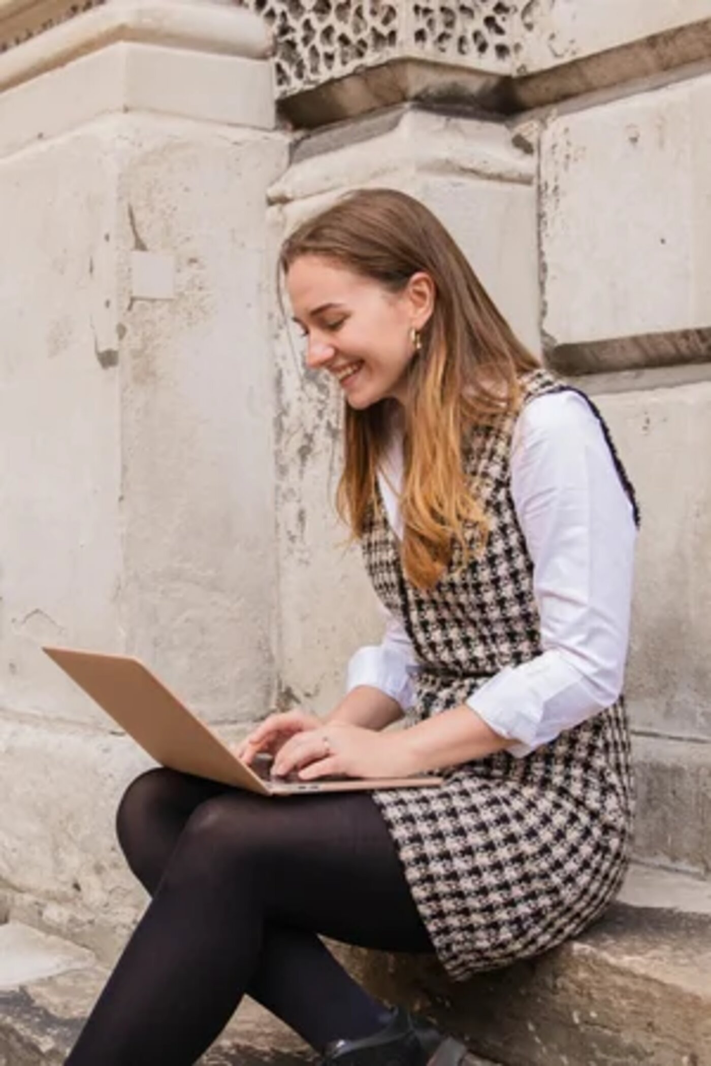 Hana Clode, interiors marketing consultant, working on a laptop