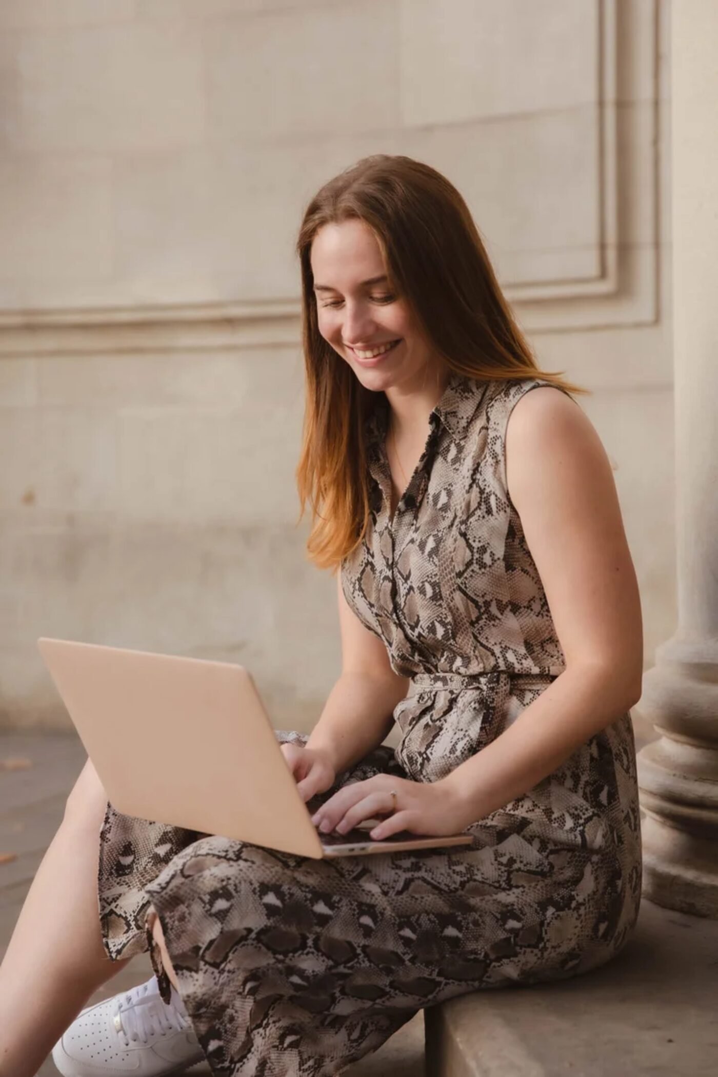 Hana Clode, interiors marketing consultant, working on a laptop.