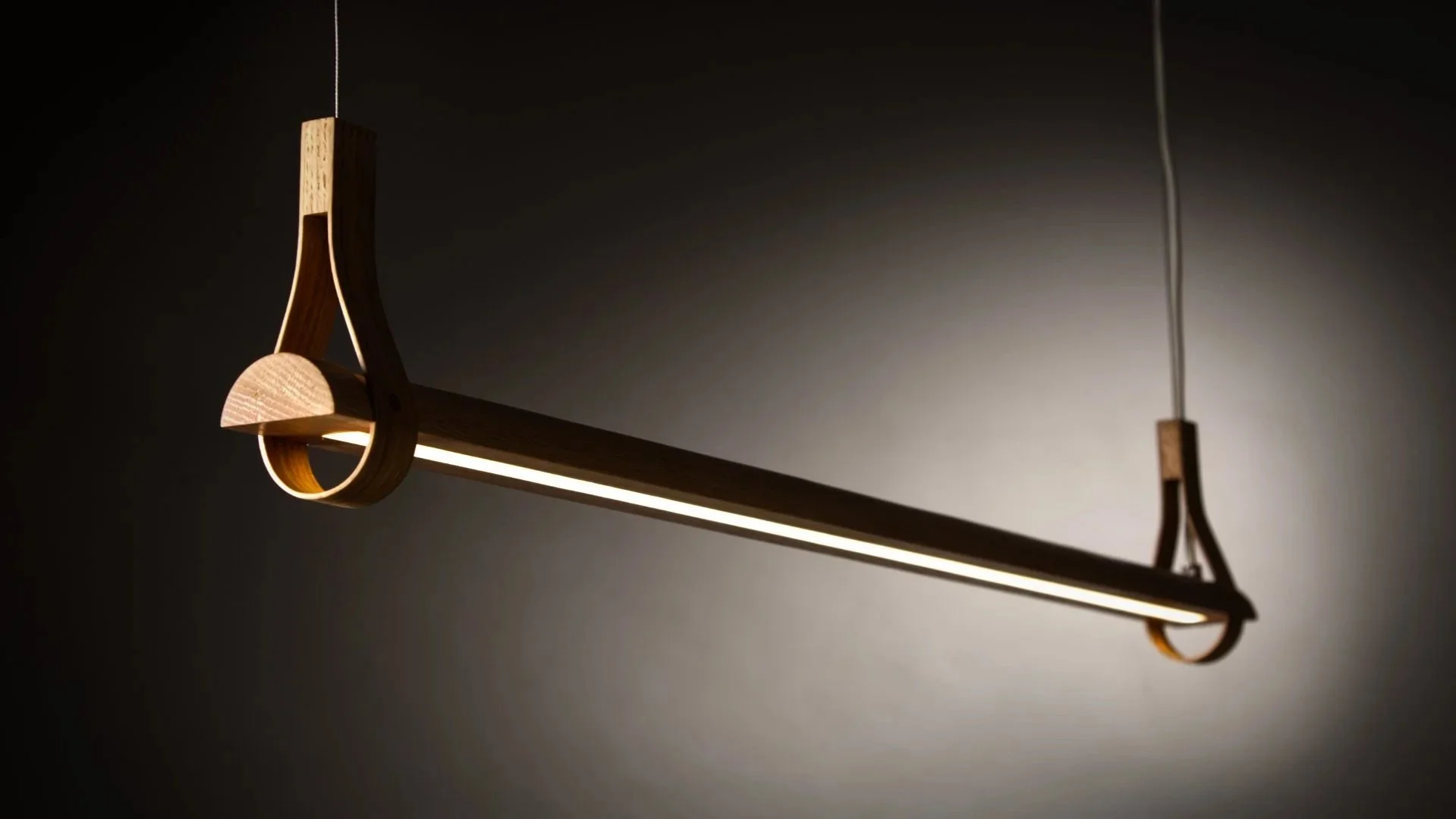 Arda is a modern wooden hanging bar light  combining minimalist design with the warmth and tactility of solid wood