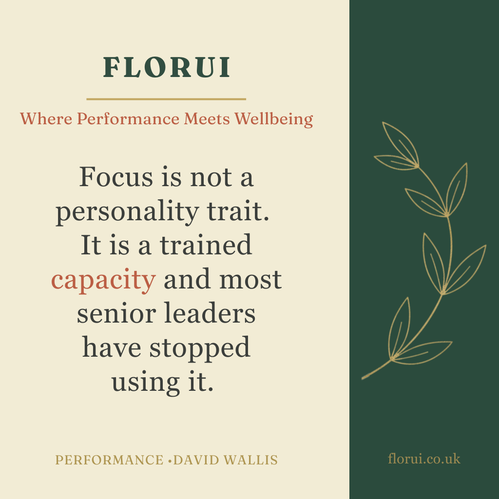 A motivational quote on a green and beige background with a leaf illustration. The quote advises that focus is a trained capacity, not a personality trait, and notes that many senior leaders have stopped using it.