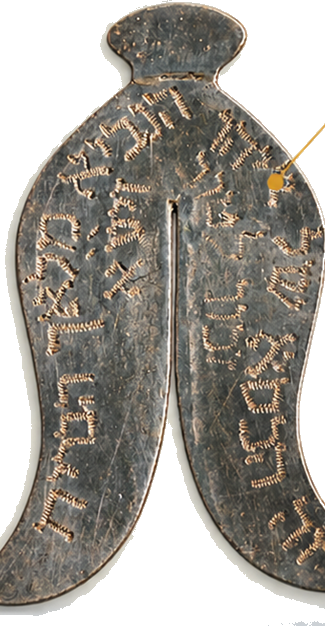Old metal cribbage board with engraved numbers and markings for scoring.